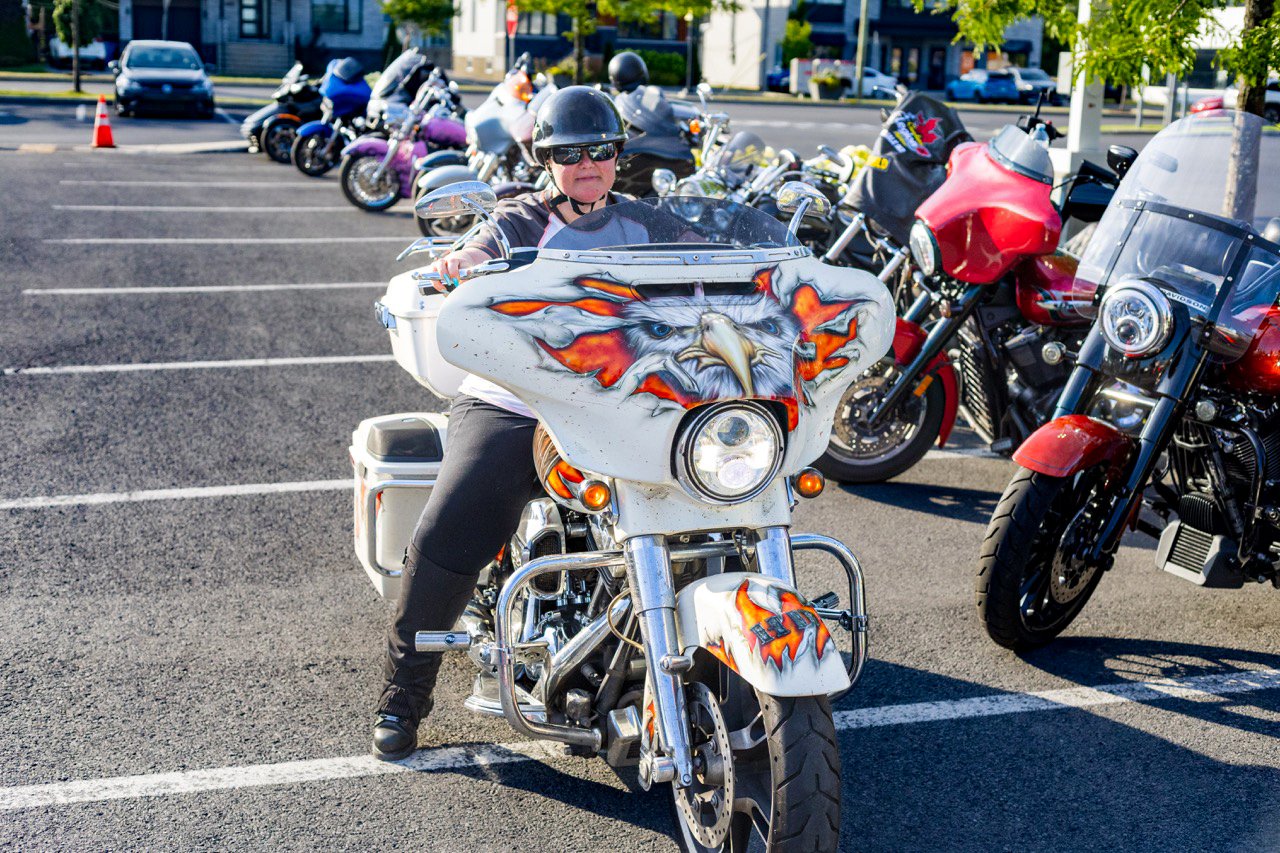 Group of diverse motorcycles lined up at the event