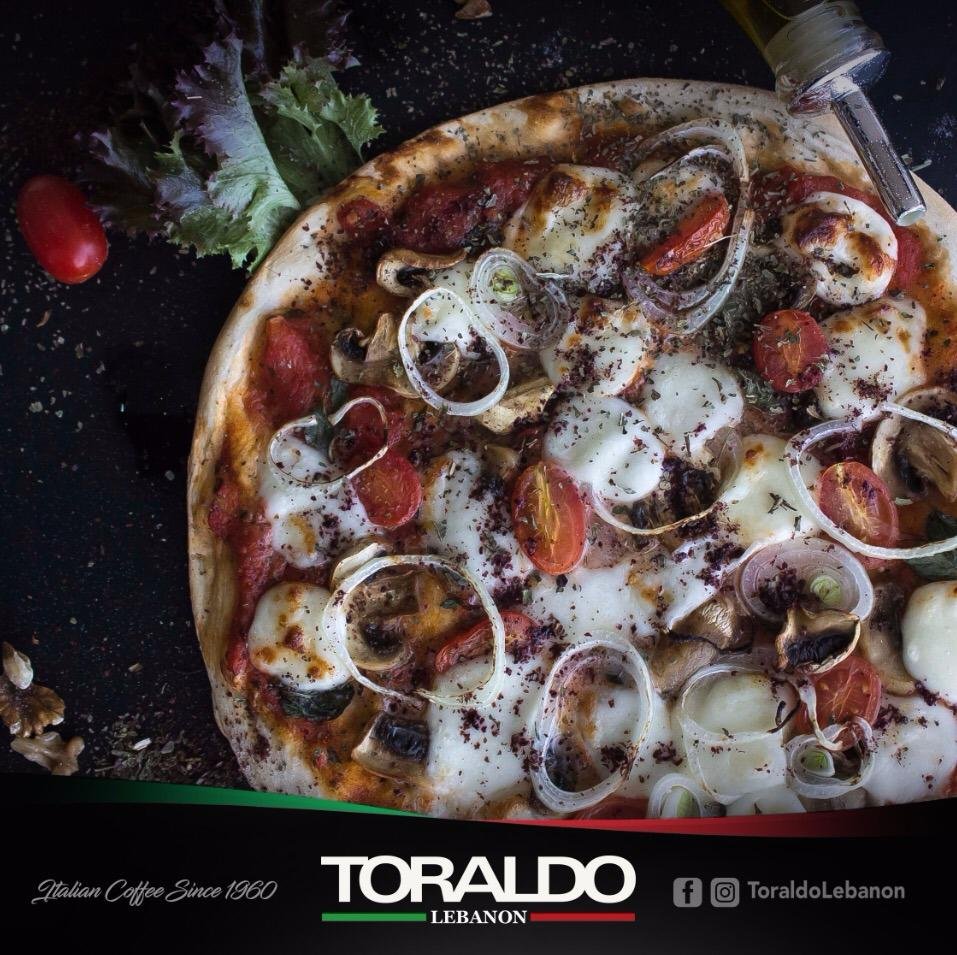 A social media post featuring a pizza