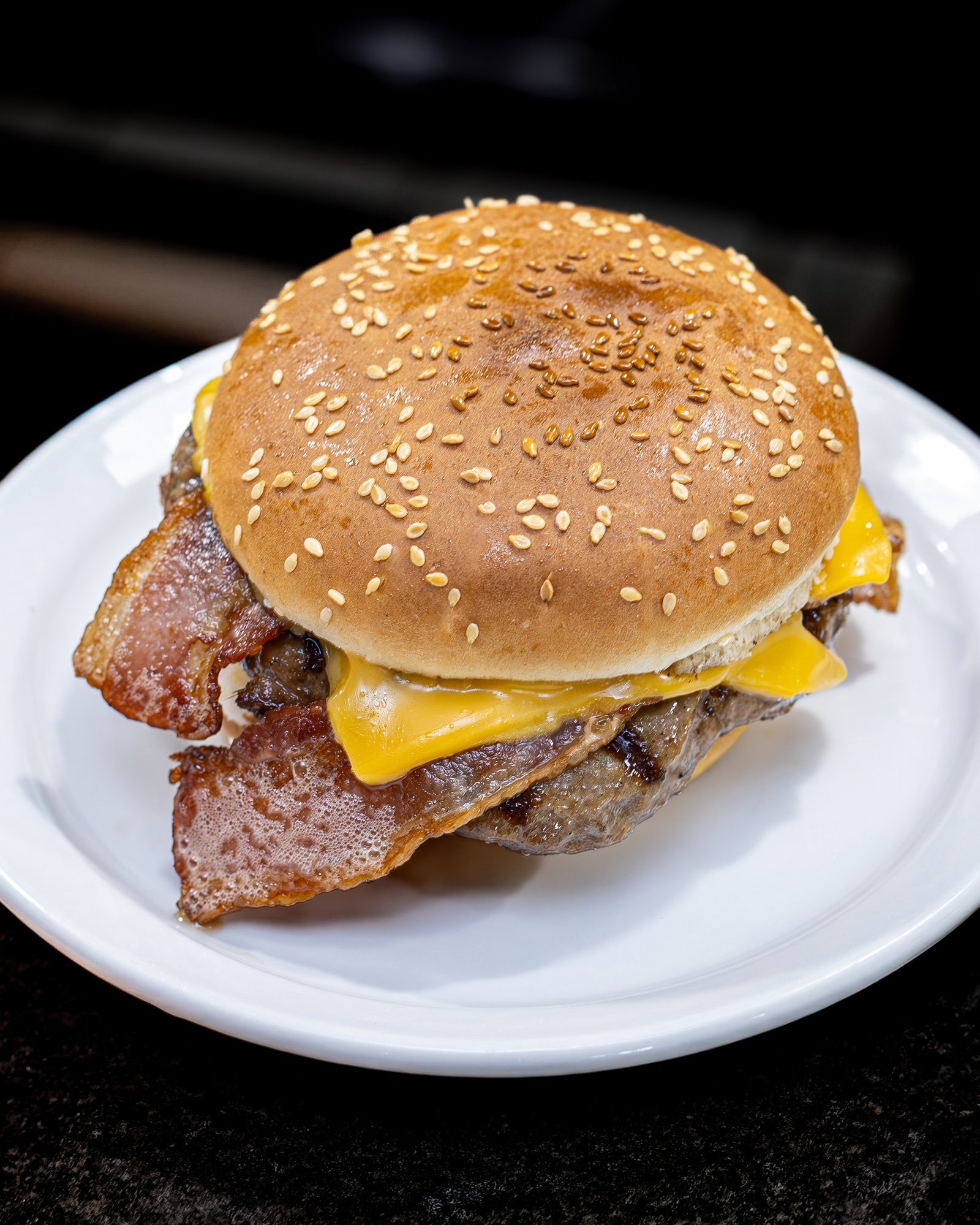 A powerful hero shot of a classic burger from the Québécois Diner Collection.