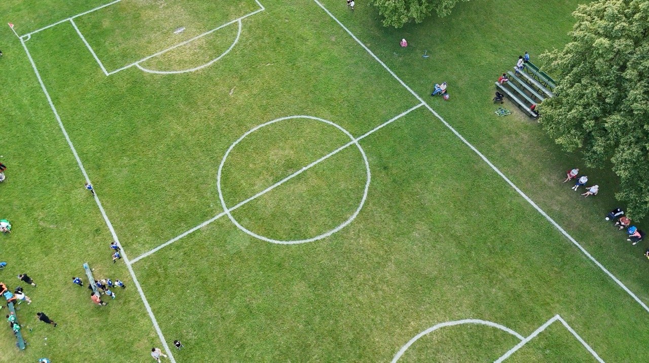 Wide aerial shot of a park and waterway.