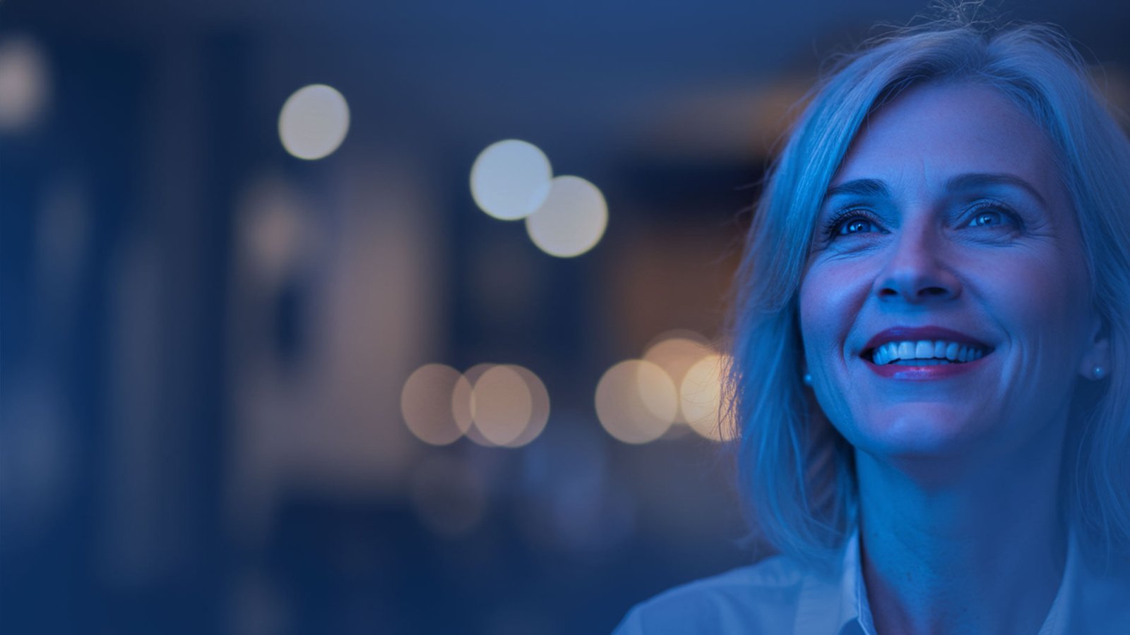 Smiling business owner collaborating with 26 Branding Agency team